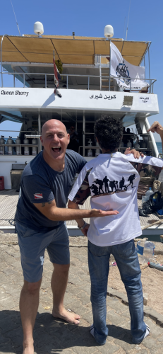 Wayne demonstrating his Trident Warriors T-shirt